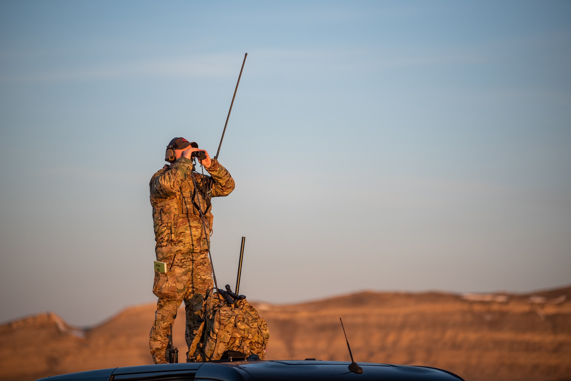 An Airman from the Kentucky Air National Guard’s 123rd Special Tactics Squadron surveys the area around Highway 287 in Wyoming during Exercise Agile Chariot on April 30, 2023, honing capabilities linked to Agile Combat Employment. Instead of relying on large, fixed bases and infrastructure, ACE employs smaller, more dispersed locations and teams to rapidly move aircraft, pilots and other personnel as needed. Under ACE, millions of miles of public roads can serve as functional runways with Forward Arming and Refueling Points when necessary. (U.S. Air National Guard photo by Master Sgt. Phil Speck)