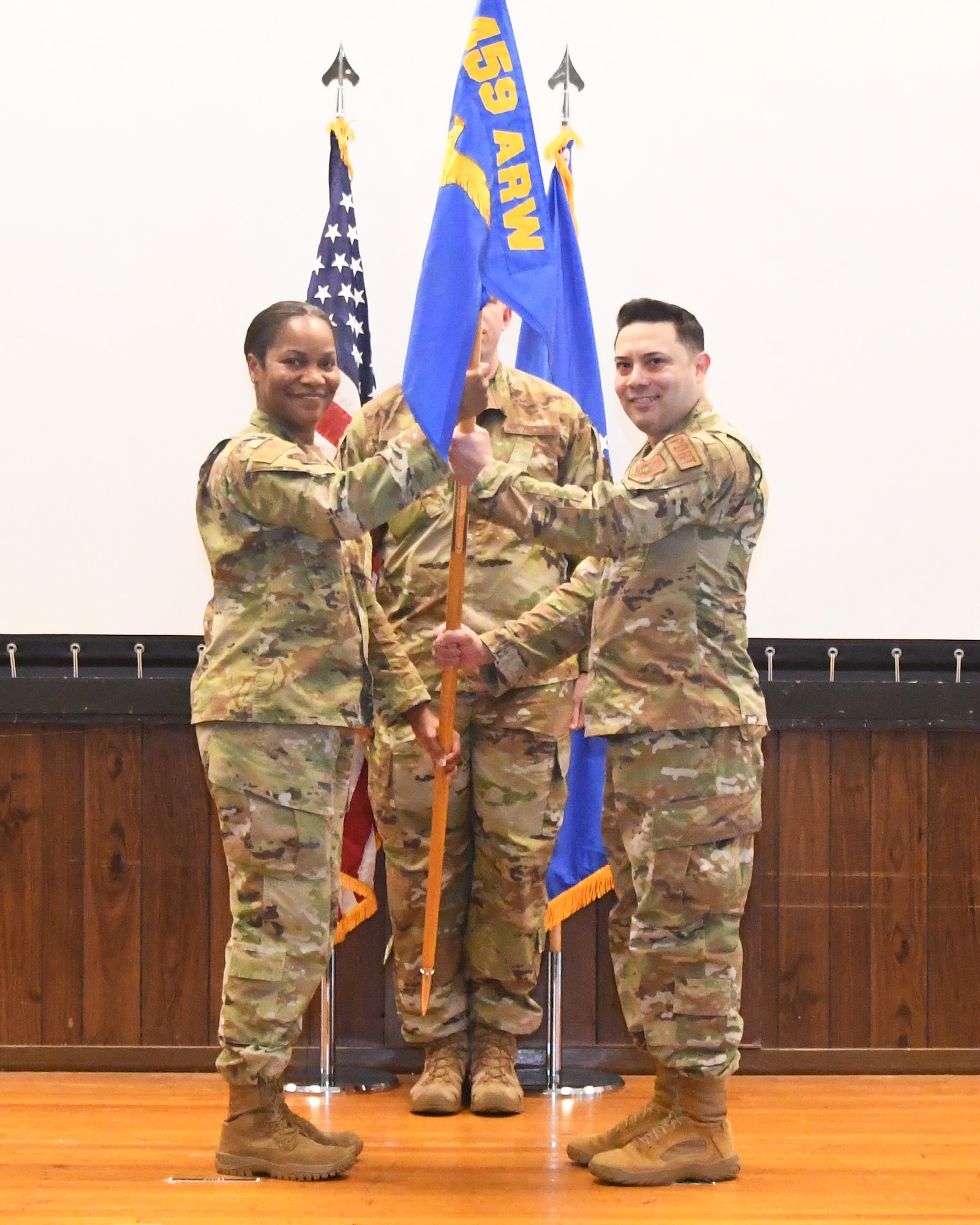 Lt. Col. Adrian Simental (right) assumes command of the 69th Aerial Port Squadron during a ceremony in the wing's auditorium on May 6, 2023. Col. Vianesa Vargas, 459th Mission Support Group Commander, was the presiding official. Simental was previously a member of the 514th Air Mobility Wing at Joint Base McGuire-Dix-Lakehurst, N.J.