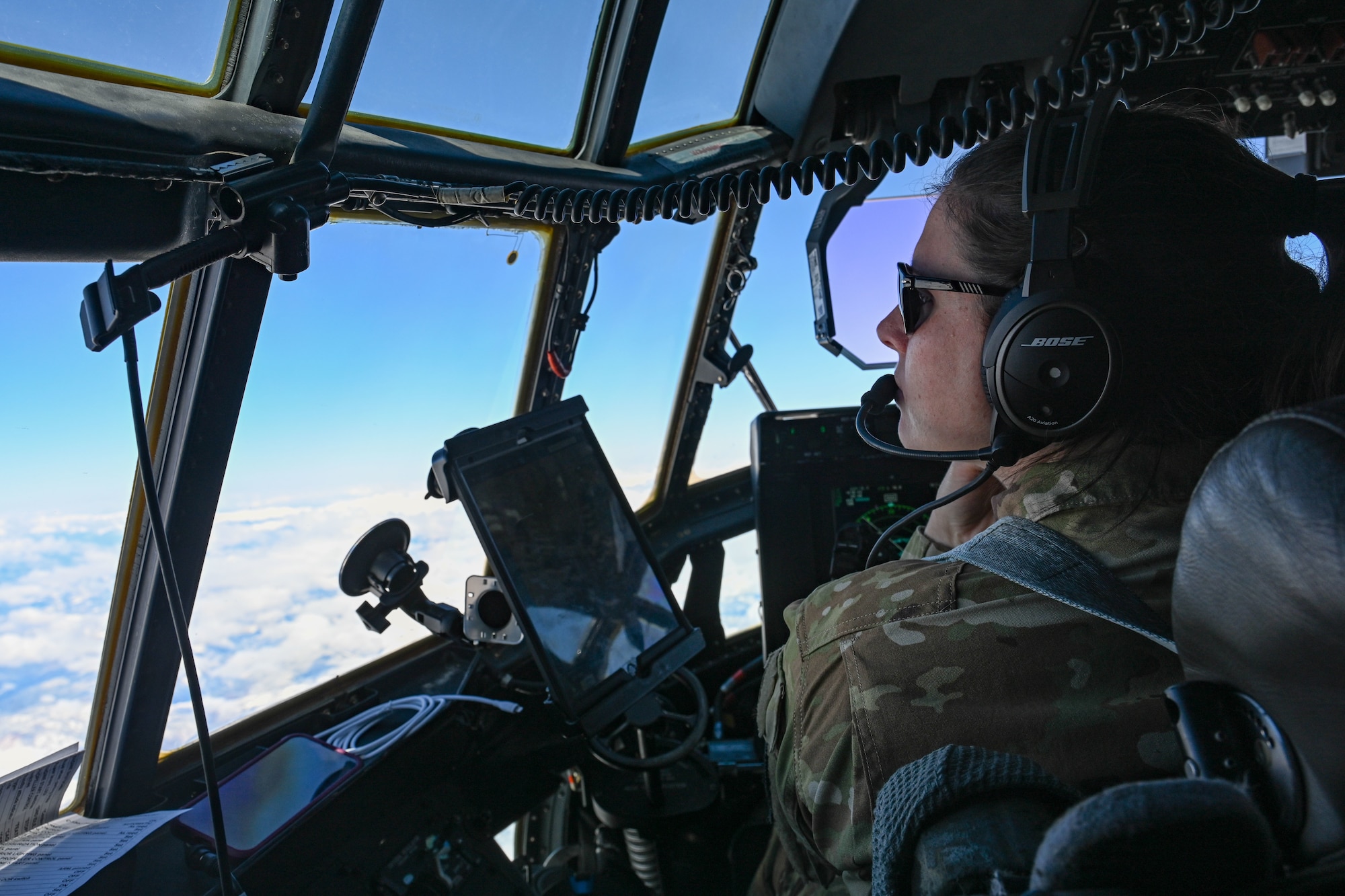 An airman flies a C-130J Super Hercules to Canada