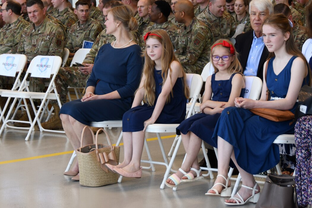 Col. Joseph H. Stepp IV's daughters and wife await the start of the 145th Airlift Wing (AW) Change of Command Ceremony held at the North Carolina Air National Guard Base, Charlotte Douglas International Airport, May 7, 2023.