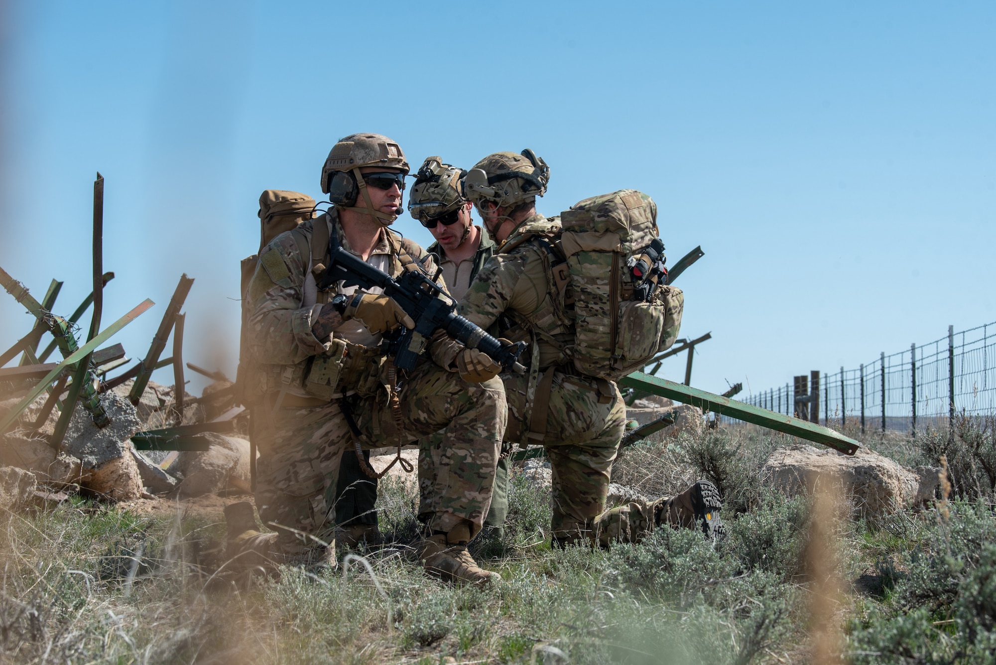 Airmen with the Kentucky Air National Guard’s 123rd Special Tactics Squadron help a simulated injured pilot during Exercise Agile Chariot near Riverton, Wyoming, May 2, 2023. Agile Chariot tested Agile Combat Employment capabilities, including using smaller, more dispersed locations and teams to rapidly move and support aircraft, pilots and other personnel wherever they’re needed. (U.S. Air National Guard photo by Master Sgt. Phil Speck)