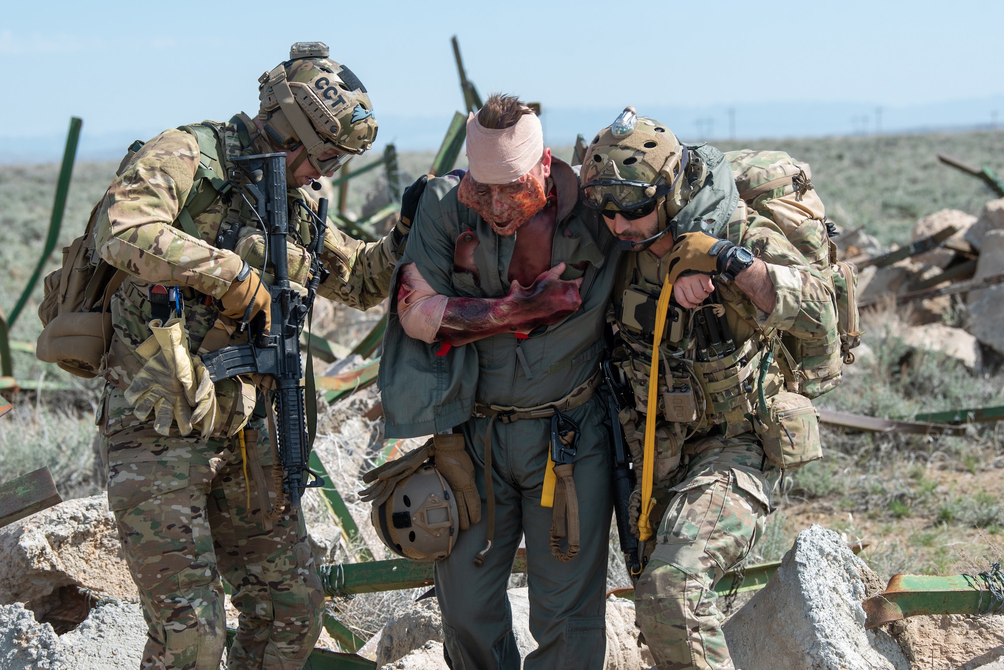 Airmen with the Kentucky Air National Guard’s 123rd Special Tactics Squadron help a simulated injured pilot during Exercise Agile Chariot near Riverton, Wyoming, May 2, 2023. Agile Chariot tested Agile Combat Employment capabilities, including using smaller, more dispersed locations and teams to rapidly move and support aircraft, pilots and other personnel wherever they’re needed. (U.S. Air National Guard photo by Master Sgt. Phil Speck)