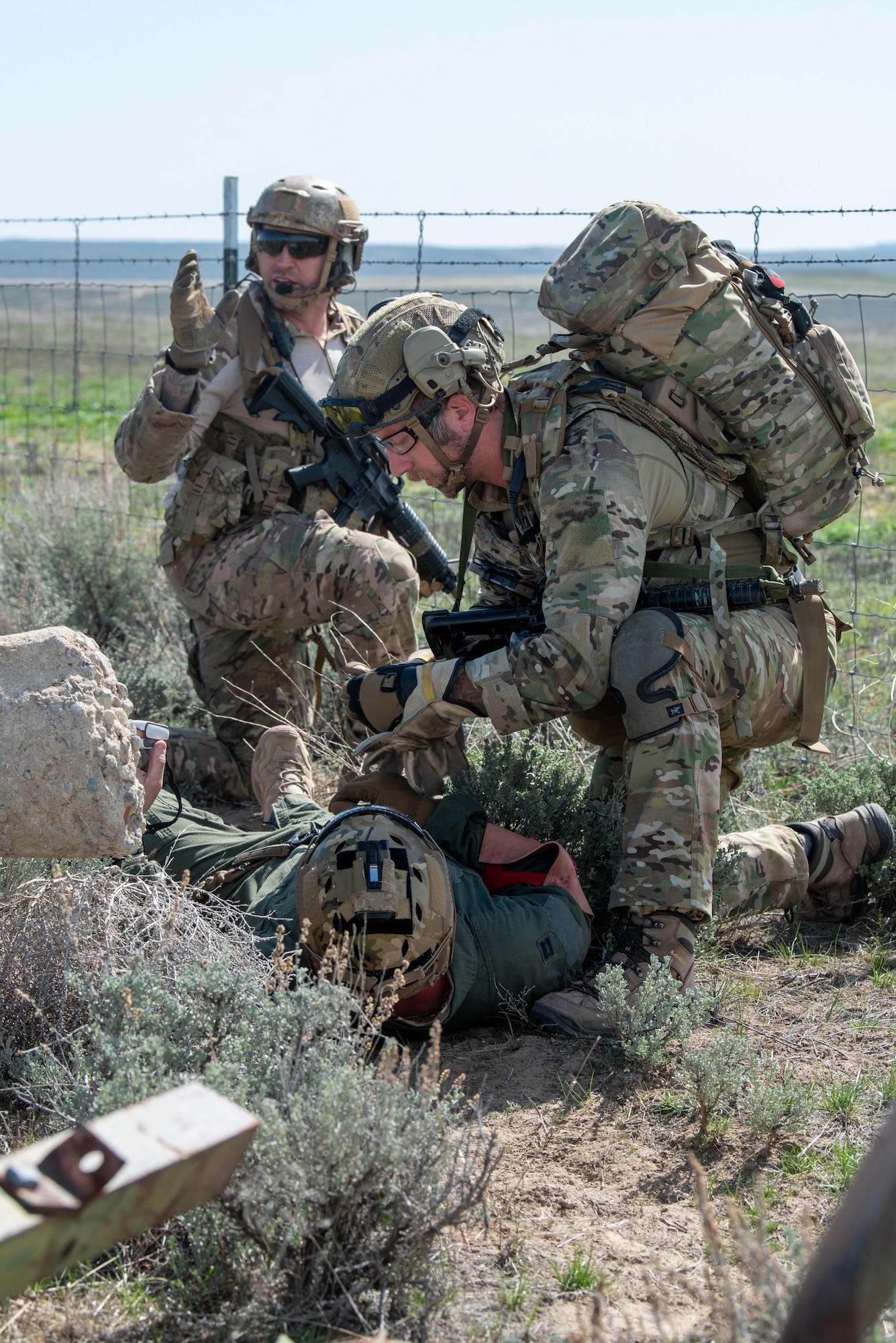 Airmen with the Kentucky Air National Guard’s 123rd Special Tactics Squadron help a simulated injured pilot during Exercise Agile Chariot near Riverton, Wyoming, May 2, 2023. Agile Chariot tested Agile Combat Employment capabilities, including using smaller, more dispersed locations and teams to rapidly move and support aircraft, pilots and other personnel wherever they’re needed. (U.S. Air National Guard photo by Master Sgt. Phil Speck)