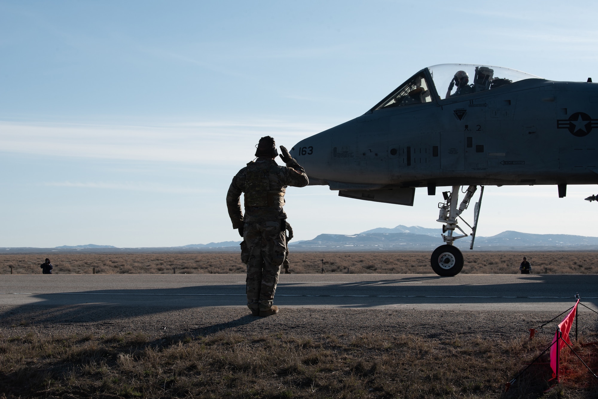 A pilot with the 127th Fighter Wing prepares to take off from Highway 287 in Wyoming during Exercise Agile Chariot on April 30, 2023, honing capabilities linked to Agile Combat Employment. Instead of relying on large, fixed bases and infrastructure, ACE employs smaller, more dispersed locations and teams to rapidly move aircraft, pilots and other personnel as needed. Under ACE, millions of miles of public roads can serve as functional runways with Forward Arming and Refueling Points when necessary. (U.S. Air National Guard photo by Master Sgt. Phil Speck)