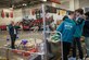 NAWCAD Lakehurst employee Adam Cyran (left) interacts with one of the teams competing at a recent FIRST Robotics competition.