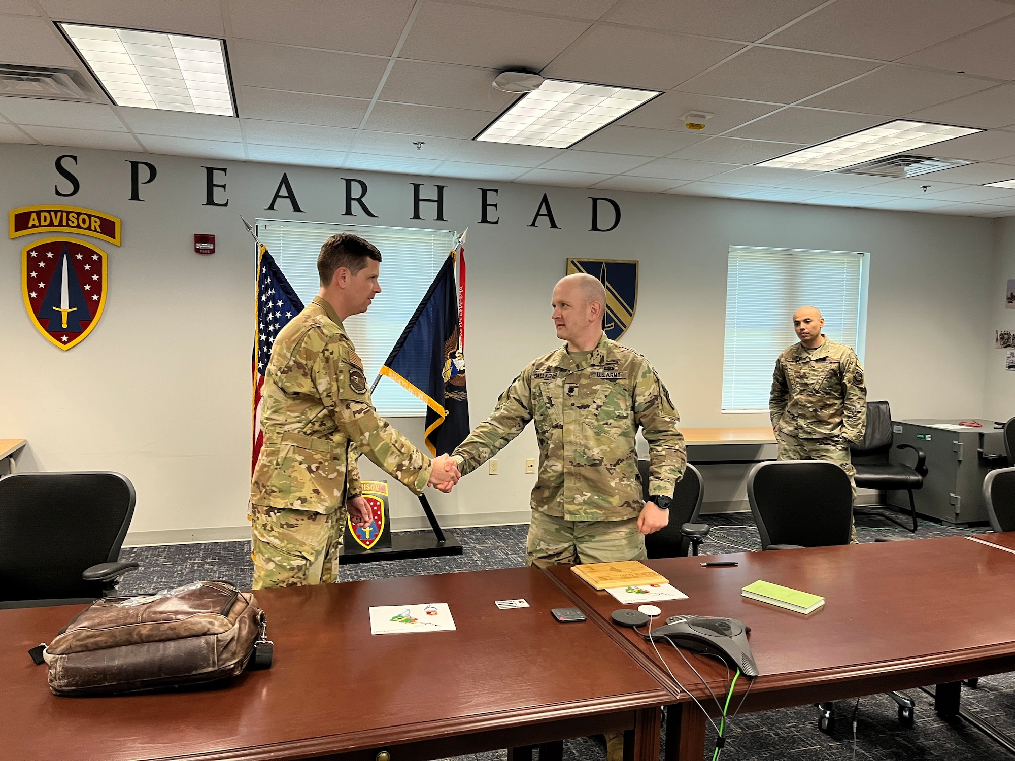 U.S. Air Force Lt. Col. Robert Chance, 571st Mobility Support Advisory Squadron commander, shakes the hand of U.S. Army Lt. Col. James Gallagher, 1st Security Force Assistance Brigade executive officer, at Fort Benning, Georgia, April 20, 2023.