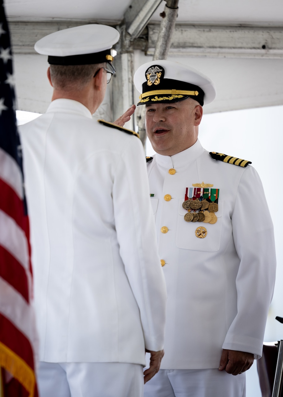 Military Sealift Command’s leadership in the Atlantic changed hands, when Navy Capt. James A. Murdock relieved Navy Capt. Daniel E. Broadhurst as commander of Norfolk-based Military Sealift Command Atlantic (MSC Atlantic) during a change of command ceremony held aboard Navy hospital ship USNS Comfort (T-AH-20) in Naval Station Norfolk April 13, 2023. Pictured right is U.S. Navy Captain James Murdock who salutes Rear Adm. Michael A. Wettlaufer, commander of MSC.