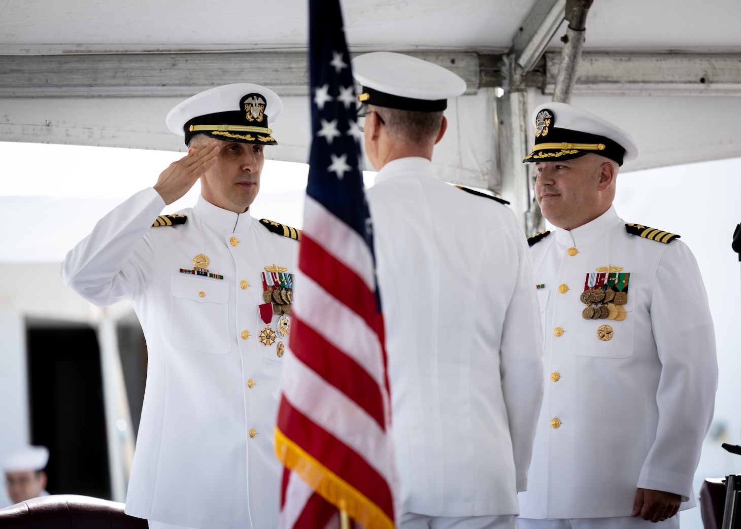 Military Sealift Command’s leadership in the Atlantic changed hands, when Navy Capt. James A. Murdock relieved Navy Capt. Daniel E. Broadhurst as commander of Norfolk-based Military Sealift Command Atlantic (MSC Atlantic) during a change of command ceremony held aboard Navy hospital ship USNS Comfort (T-AH-20) in Naval Station Norfolk April 13, 2023. Pictured from left to right are Captains Broadhurst and Murdock. Centered is Rear Adm. Michael A. Wettlaufer, commander of MSC.