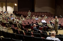 Soldier talking to group of Soldiers.