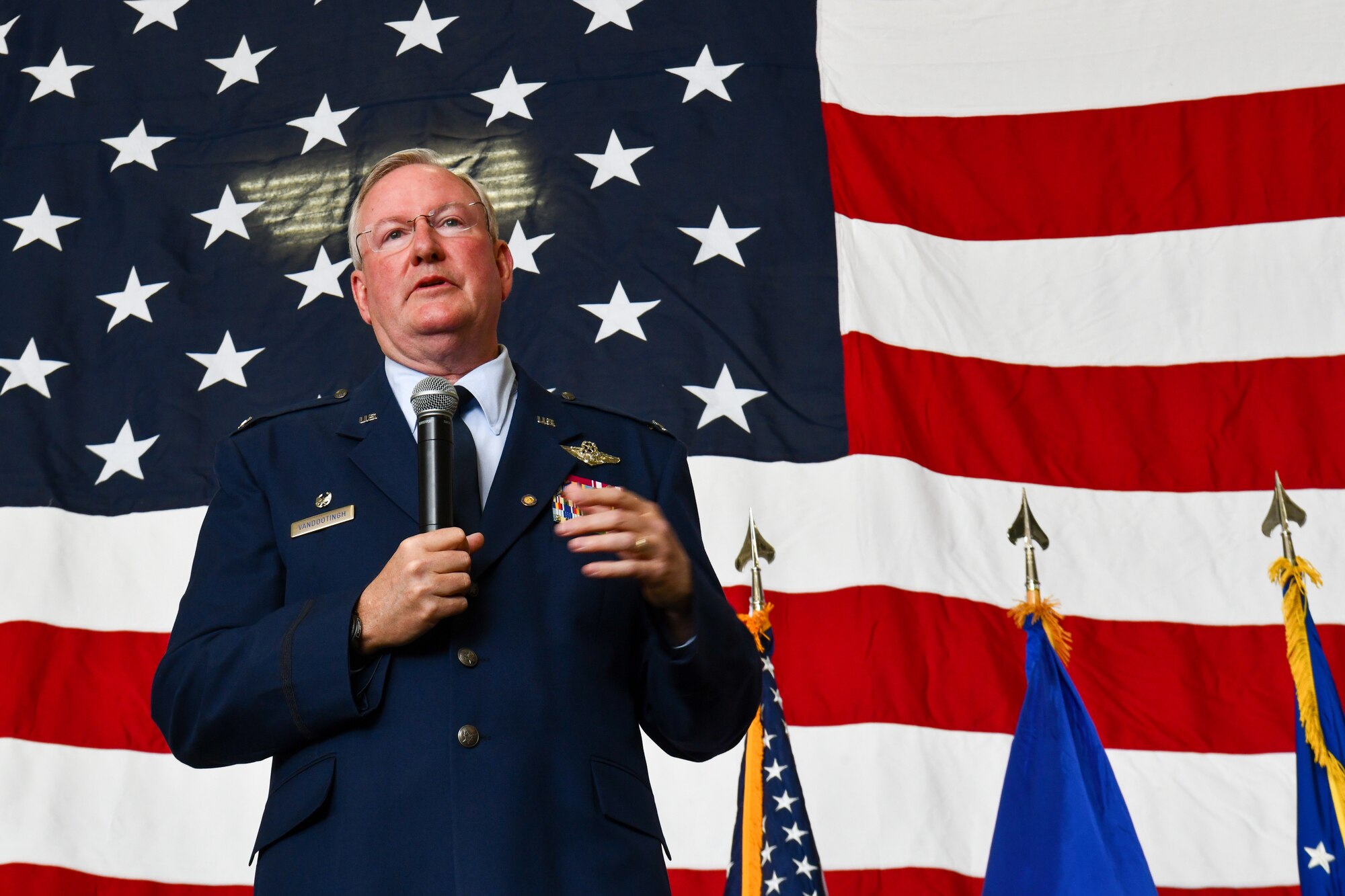Col. Jeff Van Dootingh, the commander of the 910th Airlift Wing, speaks to friends and family attending his retirement ceremony, May 6, 2023, at Youngstown Air Reserve Station, Ohio.
