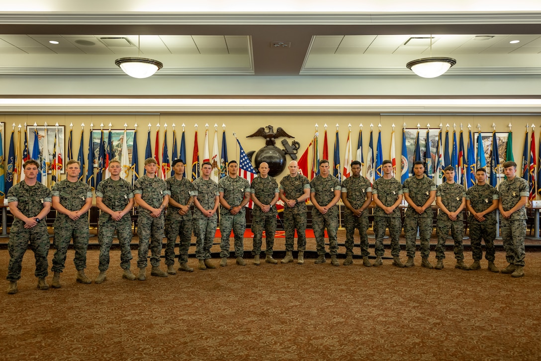 U.S. Marines from 1st Battalion, 8th Marines, 2nd Marine Division, pose for a group photo with Gen. David Berger, Commandant of the Marine Corps, and Sgt. Maj. Troy Black, Sergeant Major of the Marine Corps, during the annual Marine Corps rifle squad competition awards ceremony in the Hawkins Room at The Basic School on Marine Corps Base Quantico, Virginia, April 27, 2023.The annual Marine Corps rifle squad competition is a service-recognized competitive environment to determine, under simulated combat conditions, which Marine rifle squad most effectively demonstrates their combat capabilities and operational proficiency.