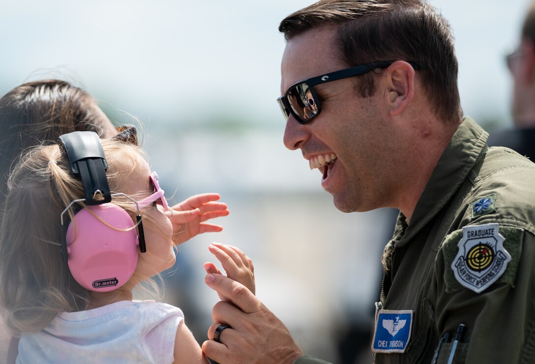 An Airman greets his family.