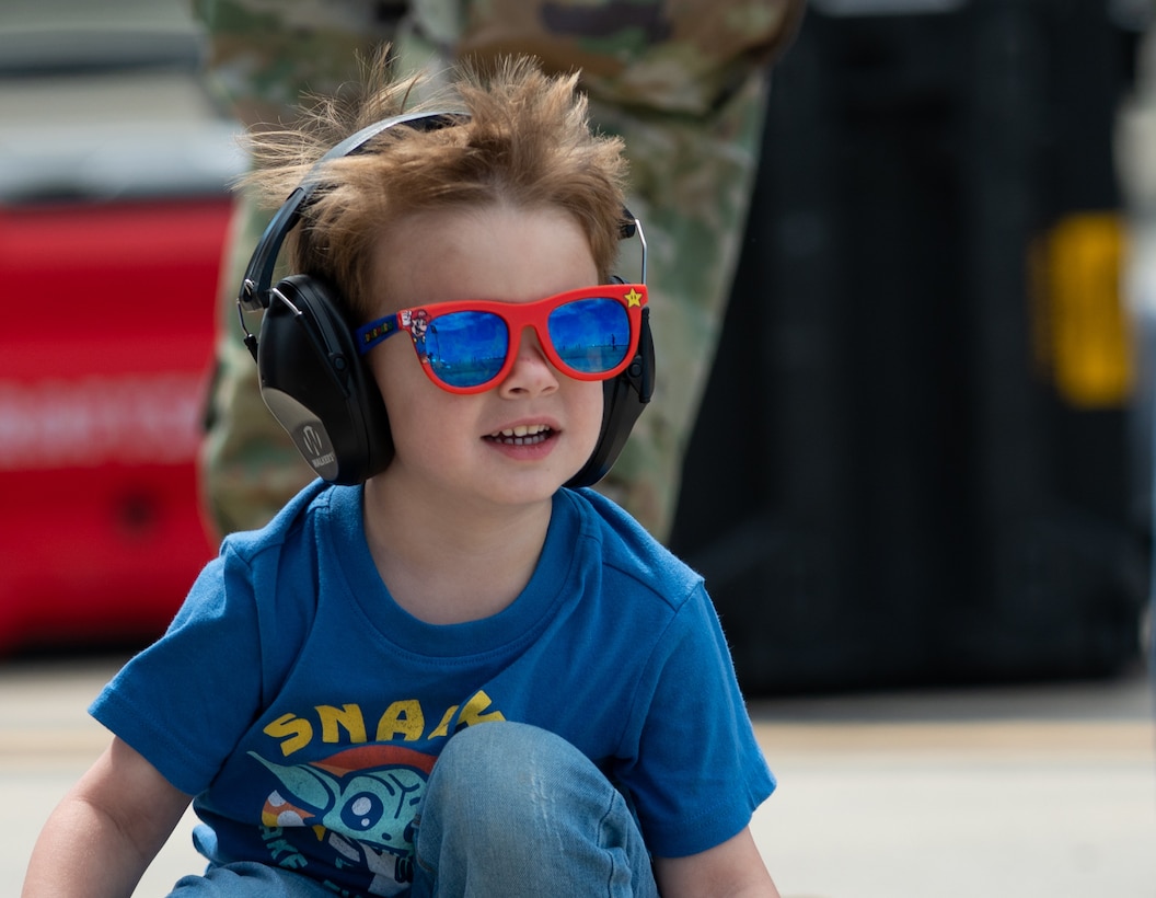 Air show attendee watches the air show.