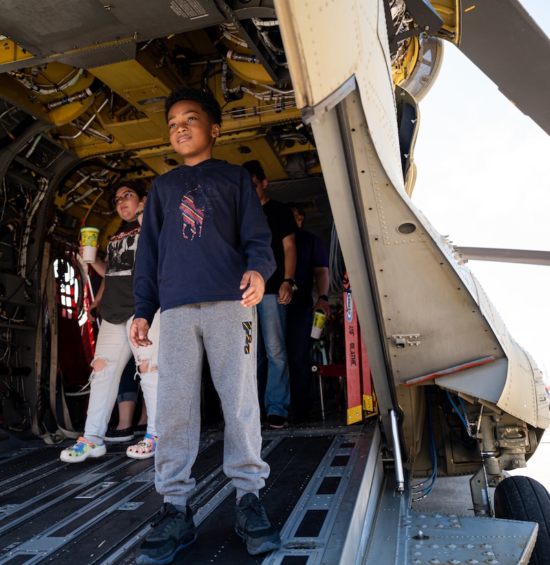 An air show attendee walks out of a helicopter display.