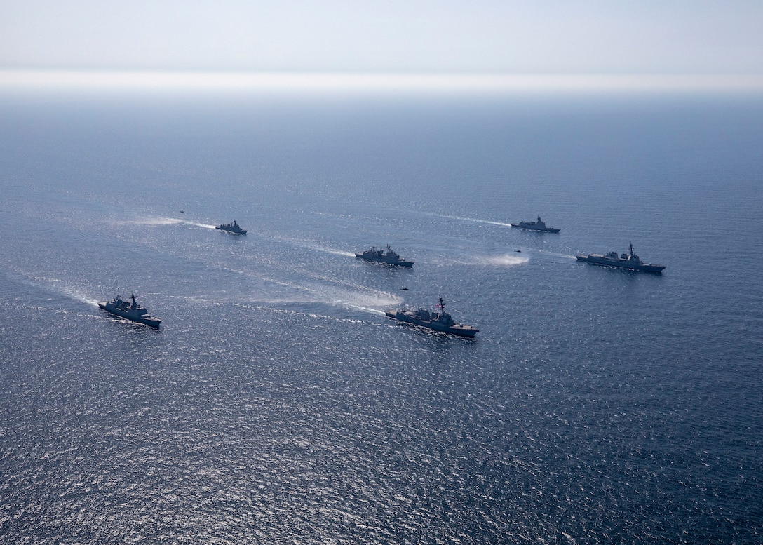 230427-N-CD453-1098 YELLOW SEA (April 27, 2023) U.S. Army AH-64D/E Apache helicopters attached to the 5th Squadron, 17th Cavalry Regiment, 2nd Combat Aviation Brigade, fly alongside Arleigh Burke-class guided-missile destroyer USS John Finn (DDG 113) as the ship sails in formation with Republic of Korea Navy ships Sejong the Great-class guided-missile destroyer ROKS Sejong the Great (DDG 991), Daegu-class frigate ROKS Seoul (FFG-821), Gwangaetto the Great-class multipurpose destroyer ROKS Eulji Mundeok (DDH-972), Chungmugong Yi Sun-sin-class multipurpose destroyer ROKS Choe Yeong (DDH 981), and Ulsan-class frigate ROKS Cheongju, during Maritime Counter Special Operations Exercise (MCSOFEX) in the Yellow Sea, April 27. John Finn is assigned to Commander, Task Force 71/Destroyer Squadron (DESRON) 15, the Navy’s largest forward-deployed DESRON and U.S. 7th Fleet’s principal surface force. (U.S. Navy photo by Mass Communication Specialist 2nd Class Samantha Oblander)