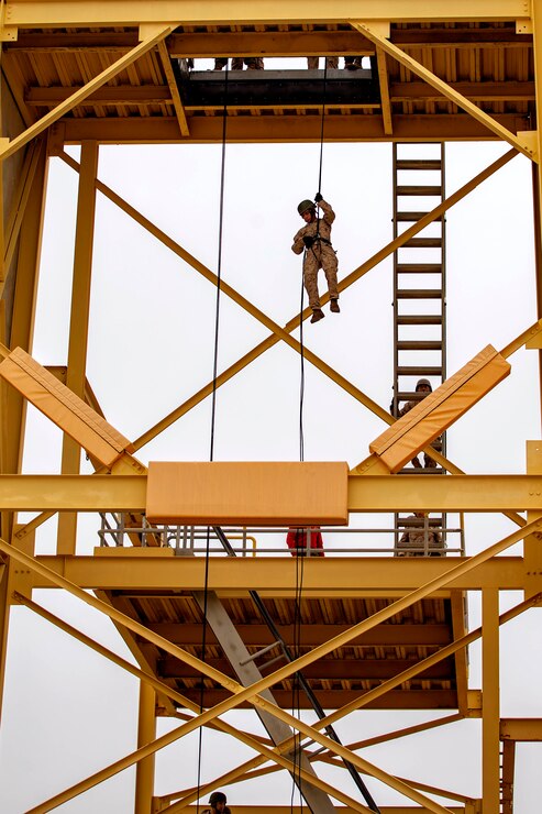 New U.S. Marines with Charlie Company, 1st Recruit Training Battalion, fast down the rappel tower training at Marine Corps Recruit Depot, San Diego, April 28, 2023.