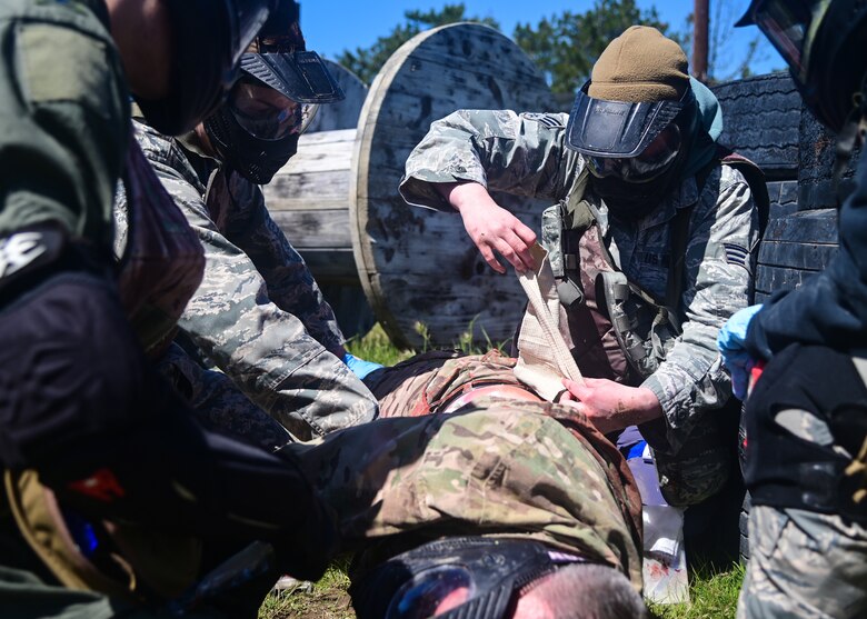 The 30th Medical Group held its first-ever Tier Two Tactical Combat Casualty Care (TCCC) course on March 24, 2022, enhancing the skills of its medical readiness personnel during potential combat situations. The course culminated with a field training exercise in which personnel provided medical care to volunteers and mannequins. TCCC is the new standard across all U.S. military service branches. (U.S. Space Force photo by Airman 1st Class Ryan Quijas)