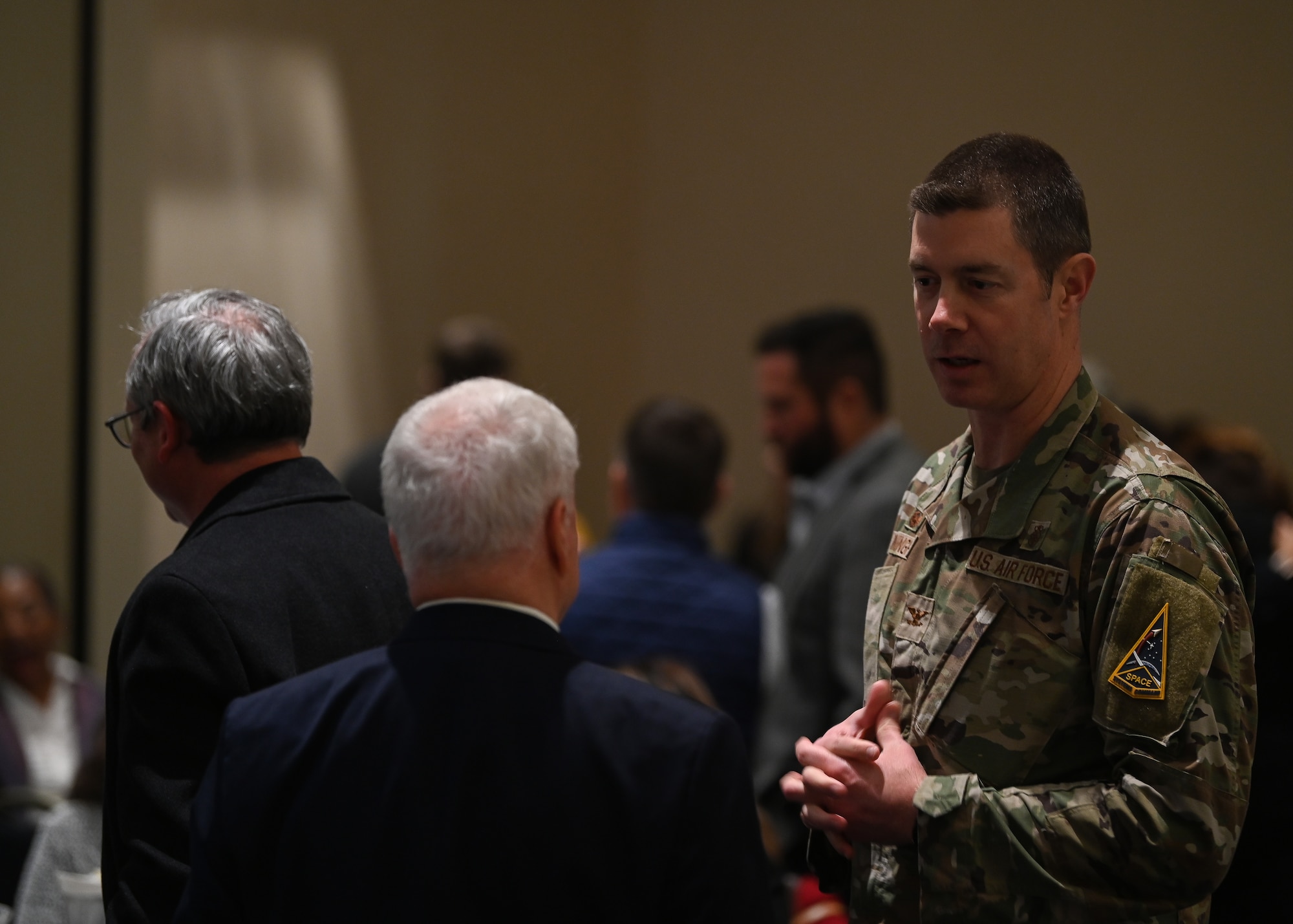 U.S. Air Force Col. Brent Cunningham, 30th Medical Group commander, speaks with Jim Bray, Santa Maria Chamber of Commerce Military Affairs Committee co-chair, prior to the State of Vandenberg address on Vandenberg Space Force Base, Calif., March 15, 2023. The Santa Maria Valley and Lompoc Valley chambers of commerce organized the event and Col. Robert Long, Space Launch Delta 30 commander, delivered the keynote address, sharing that in 2022 the base had its busiest 12 months in 26 years. (U.S. Space Force photo by Airman 1st Class Ryan Quijas)