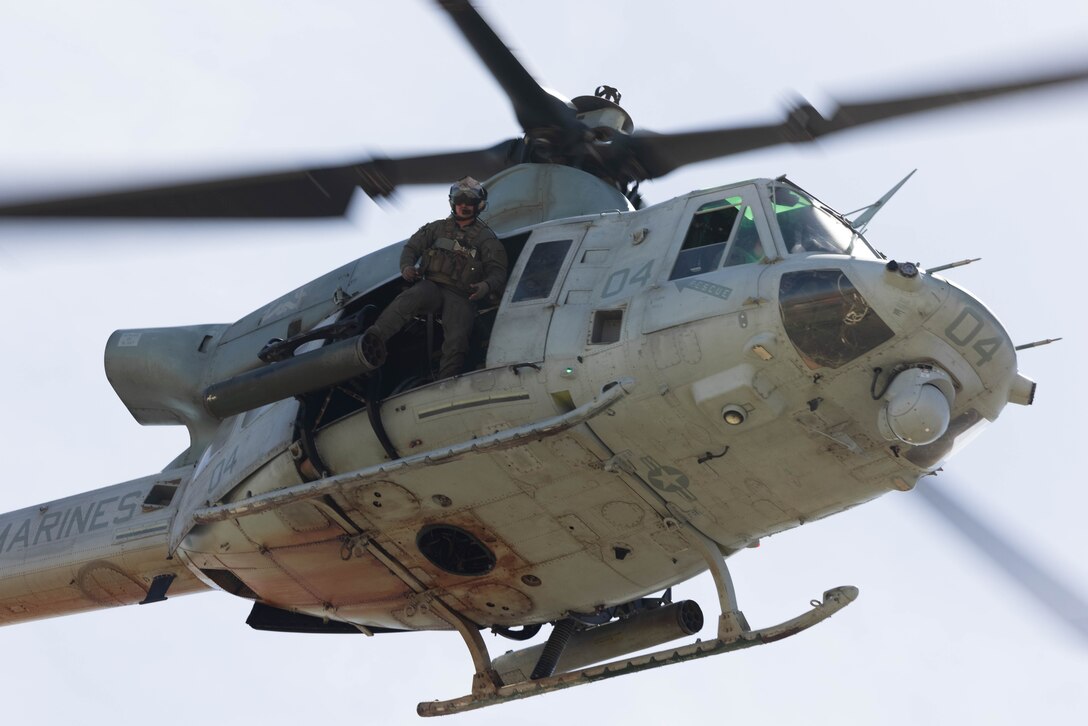 A U.S. Marine Corps UH-1Y Venom helicopter with Marine Light Attack Helicopter Squadron 369, Marine Aircraft Group 39, 3rd Marine Aircraft Wing, provides close air support during Exercise Garnet Rattler at Saylor Creek Range in Grasmere, Idaho, April 26, 2023. Garnet Rattler is a joint exercise between Marines and U.S. Airmen to train joint terminal attack controllers to be more efficient and lethal in a realistic training environment. (U.S. Marine Corps photo by Lance Cpl. Juan Torres)