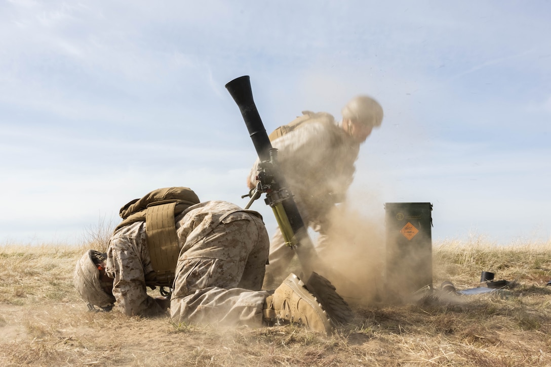 U.S. Marine Corps Lance Cpl. Melvin Rojas and Lance Cpl. Arti Hoxah, both mortarmen with 1st Battalion, 1st Marine Regiment, 1st Marine Division, fire an M252 81 mm mortar during Exercise Garnet Rattler on Saylor Creek Range in Grasmere, Idaho, April 26, 2023. Garnet Rattler is a joint exercise between Marines and U.S. Airmen to train joint terminal attack controllers to be more efficient and lethal in a realistic training environment. Rojas is a native of Irving, Texas. (U.S. Marine Corps photo by Lance Cpl. Juan Torres)