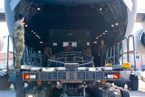 U.S. Air Force Airmen assigned to the 724th Air Mobility Squadron offload a C-17 Globemaster III aircraft from the 62nd Airlift Wing, based out of Joint Base Lewis-McChord, Wash. during Defender 23