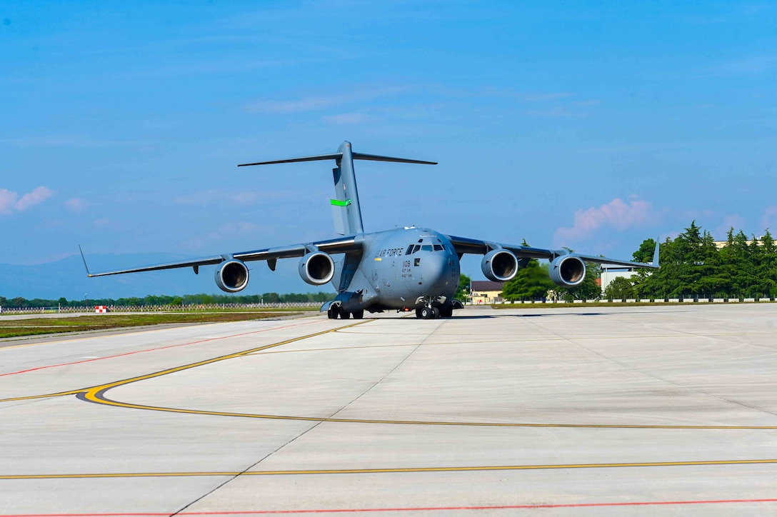 A C-17 Globemaster III aircraft from the 62nd Airlift Wing, based out of Joint Base Lewis-McChord, Wash. taxis to its drop-off location