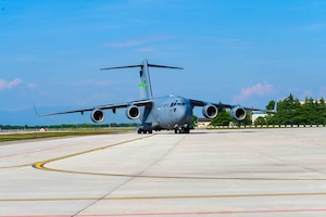 A C-17 Globemaster III aircraft from the 62nd Airlift Wing, based out of Joint Base Lewis-McChord, Wash. taxis to its drop-off location