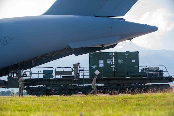 Airmen assigned to the 724th Air Mobility Squadron offload a C-17 Globemaster III aircraft from the 62nd Airlift Wing, based out of Joint Base Lewis-McChord, Wash. during Defender 23, at Aviano Air Base, Italy, May 5, 2023.