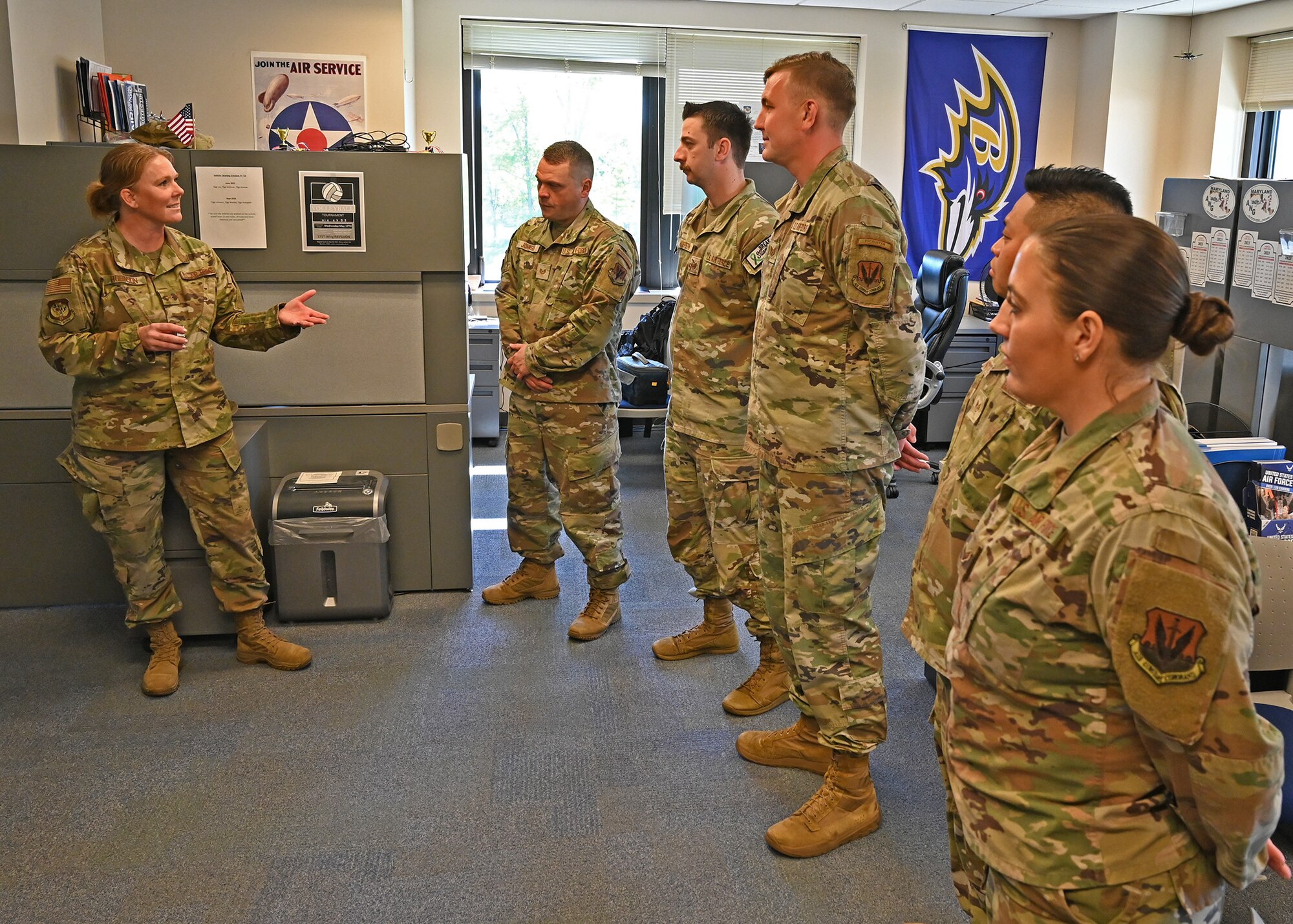 U.S. Air Force Brig. Gen. Jori Robinson, 175th Wing commander, congratulates members of the 175th Wing recruiting team at Martin State Air National Guard Base, Middle River, Md., May 6, 2023, for receiving  the Air Force Recruiting Service Top III Chief Master Sgt. Brad W. Esposito Team Leadership Award for their accomplishments in the first quarter of fiscal year 2023.