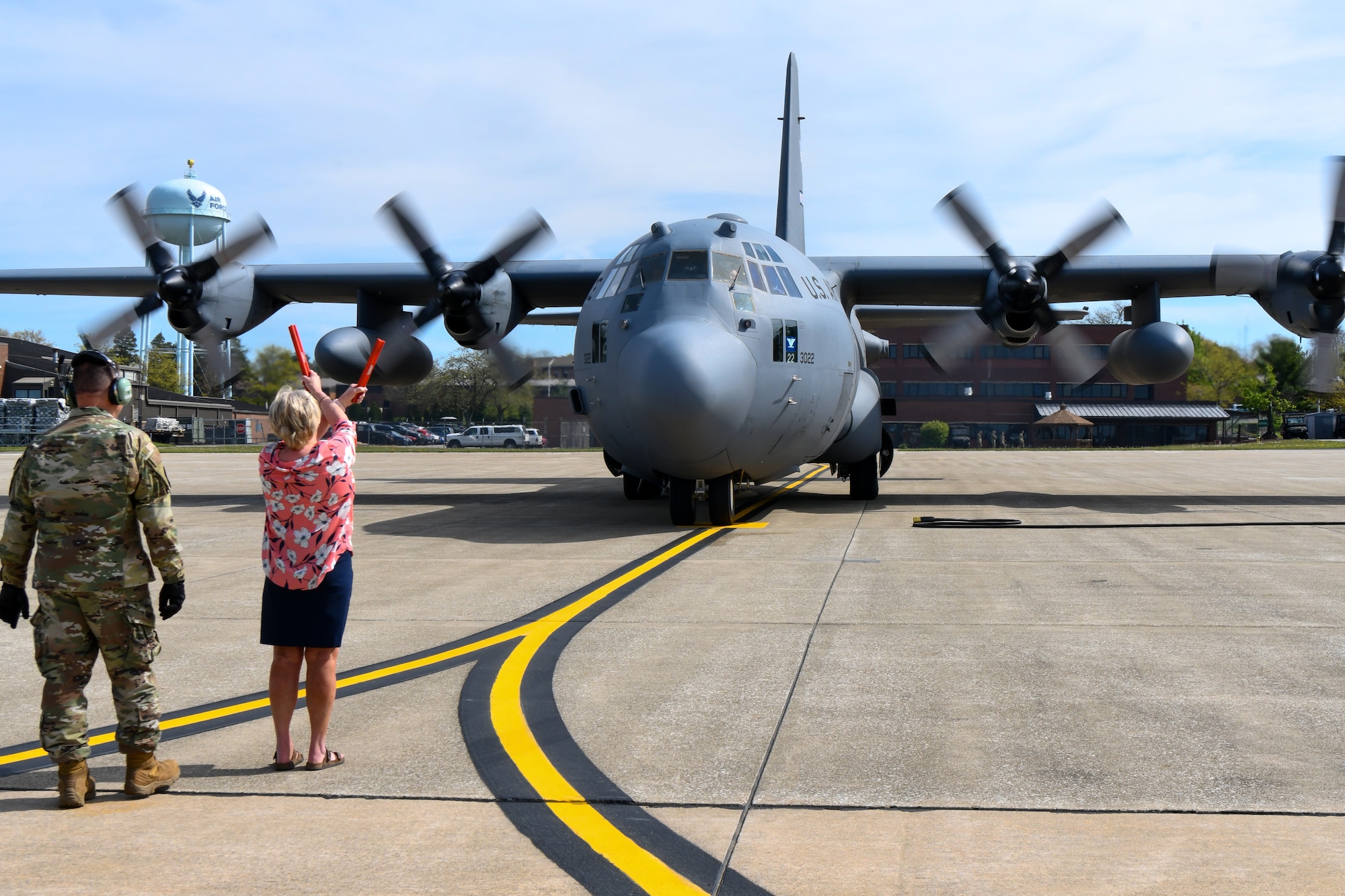 Mrs. Diana Van Dootingh marshals in her husband's “fini-flight” aboard a C-130H Hercules aircraft on May 6, 2023, at Youngstown Air Reserve Station, Ohio.