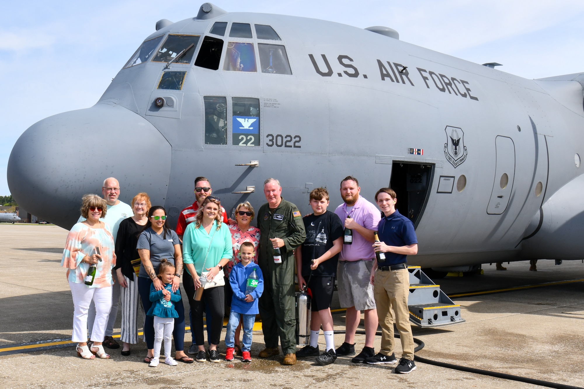 Col. Jeff Van Dootingh, the commander of the 910th Airlift Wing, and his family pose for a photo, May 6, 2023, in front of the C-130H Hercules aircraft he had just flown his “fini-flight” in.