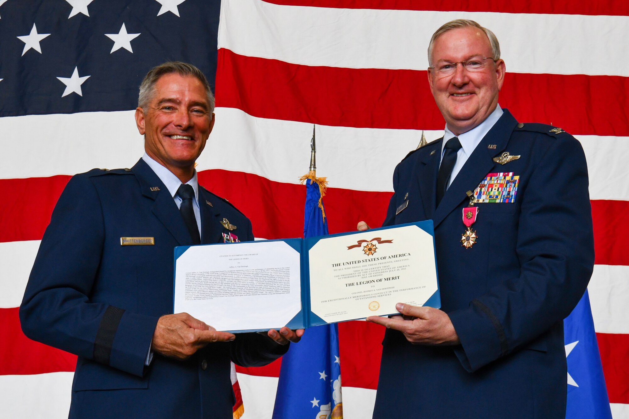 Brig Gen. Bill Whittenberger, the mobilization assistant to the commander of the Air Force Special Operations Command, awards the Legion of Merit to Col. Jeff Van Dootingh, the commander of the 910th Airlift Wing, May 6, 2023, at Youngstown Air Reserve Station, Ohio.
