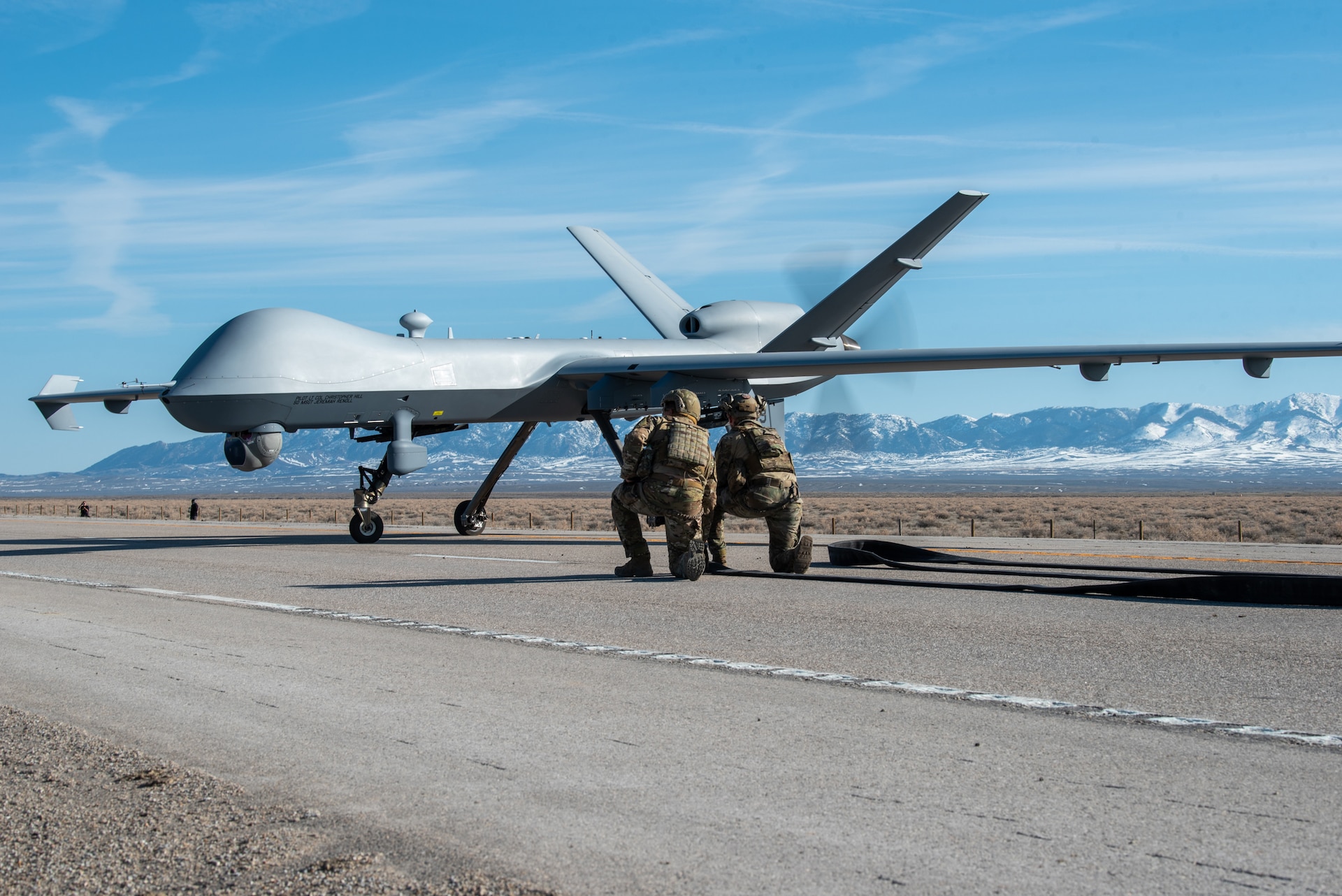 An MQ-9 Reaper prepares to take off from Highway 287 in Wyoming during Exercise Agile Chariot on April 30, 2023, honing capabilities linked to Agile Combat Employment. Instead of relying on large, fixed bases and infrastructure, ACE employs smaller, more dispersed locations and teams to rapidly move aircraft, pilots and other personnel as needed. Under ACE, millions of miles of public roads can serve as functional runways with Forward Arming and Refueling Points when necessary. (U.S. Air National Guard photo by Master Sgt. Phil Speck)