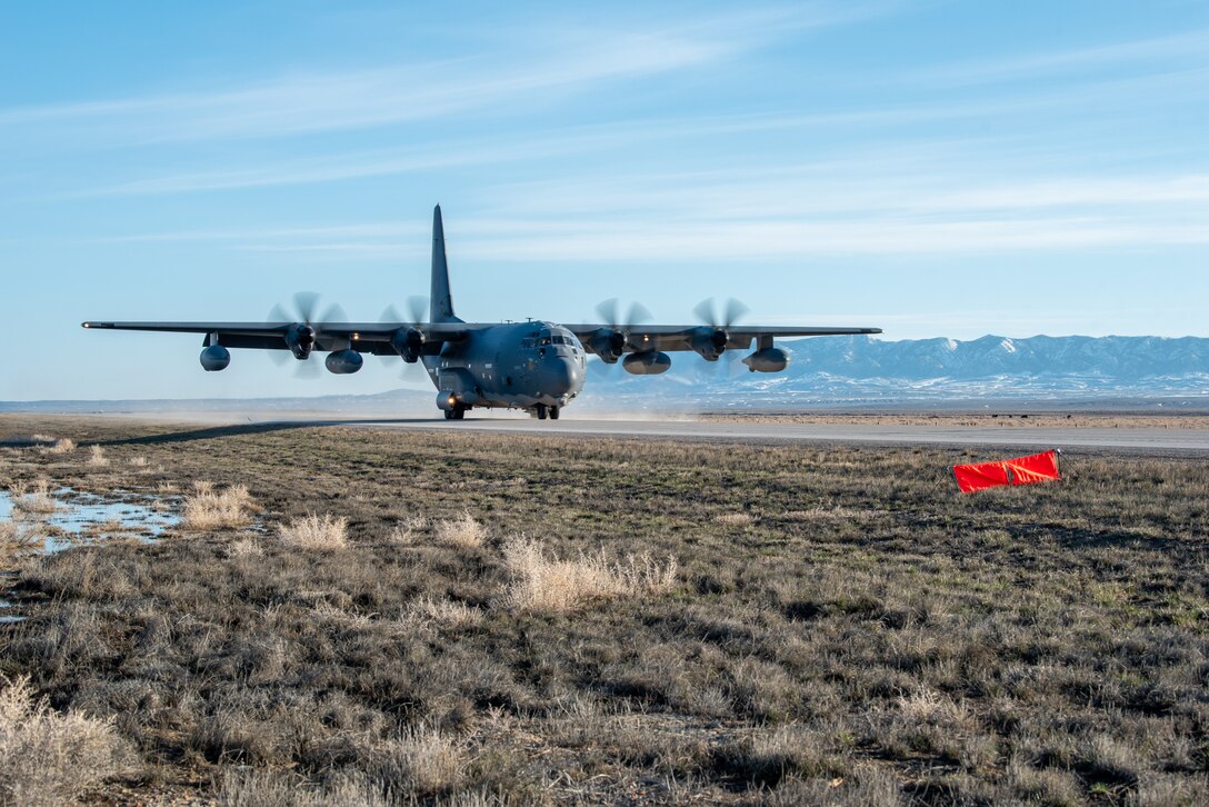 An MC-130J Commando II with the 1st Special Operations Wing lands on Highway 287 in Wyoming during Exercise Agile Chariot on April 30, 2023, honing capabilities linked to Agile Combat Employment. Instead of relying on large, fixed bases and infrastructure, ACE employs smaller, more dispersed locations and teams to rapidly move aircraft, pilots and other personnel as needed. Under ACE, millions of miles of public roads can serve as functional runways with Forward Arming and Refueling Points when necessary. (U.S. Air National Guard photo by Master Sgt. Phil Speck)