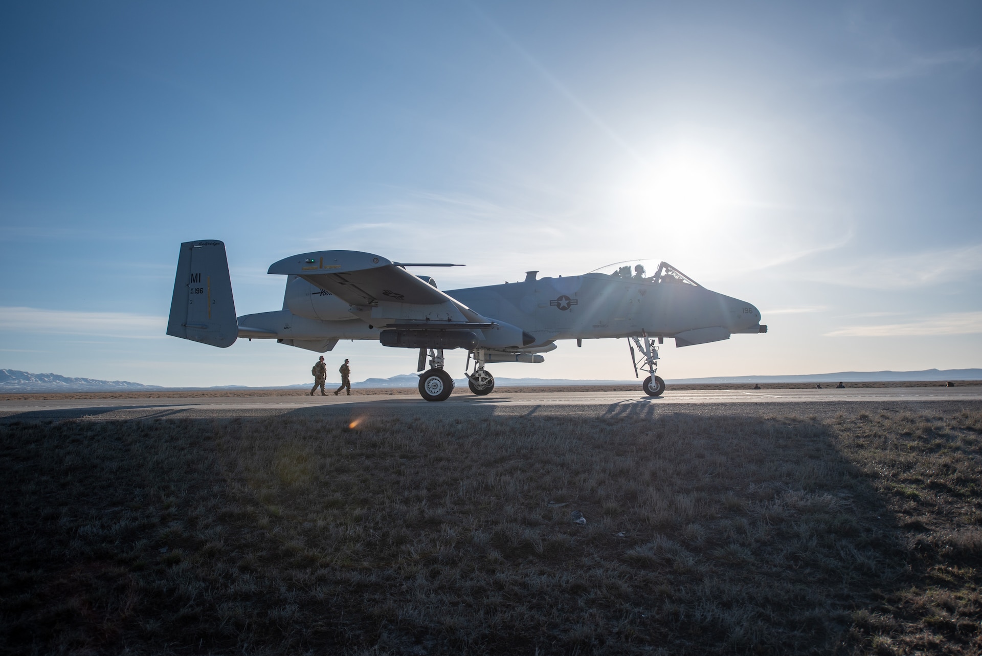 An A-10 Thunderbolt II lands on Highway 287 in Wyoming during Exercise Agile Chariot on April 30, 2023, honing capabilities linked to Agile Combat Employment. Instead of relying on large, fixed bases and infrastructure, ACE employs smaller, more dispersed locations and teams to rapidly move aircraft, pilots and other personnel as needed. Under ACE, millions of miles of public roads can serve as functional runways with Forward Arming and Refueling Points when necessary. (U.S. Air National Guard photo by Master Sgt. Phil Speck)