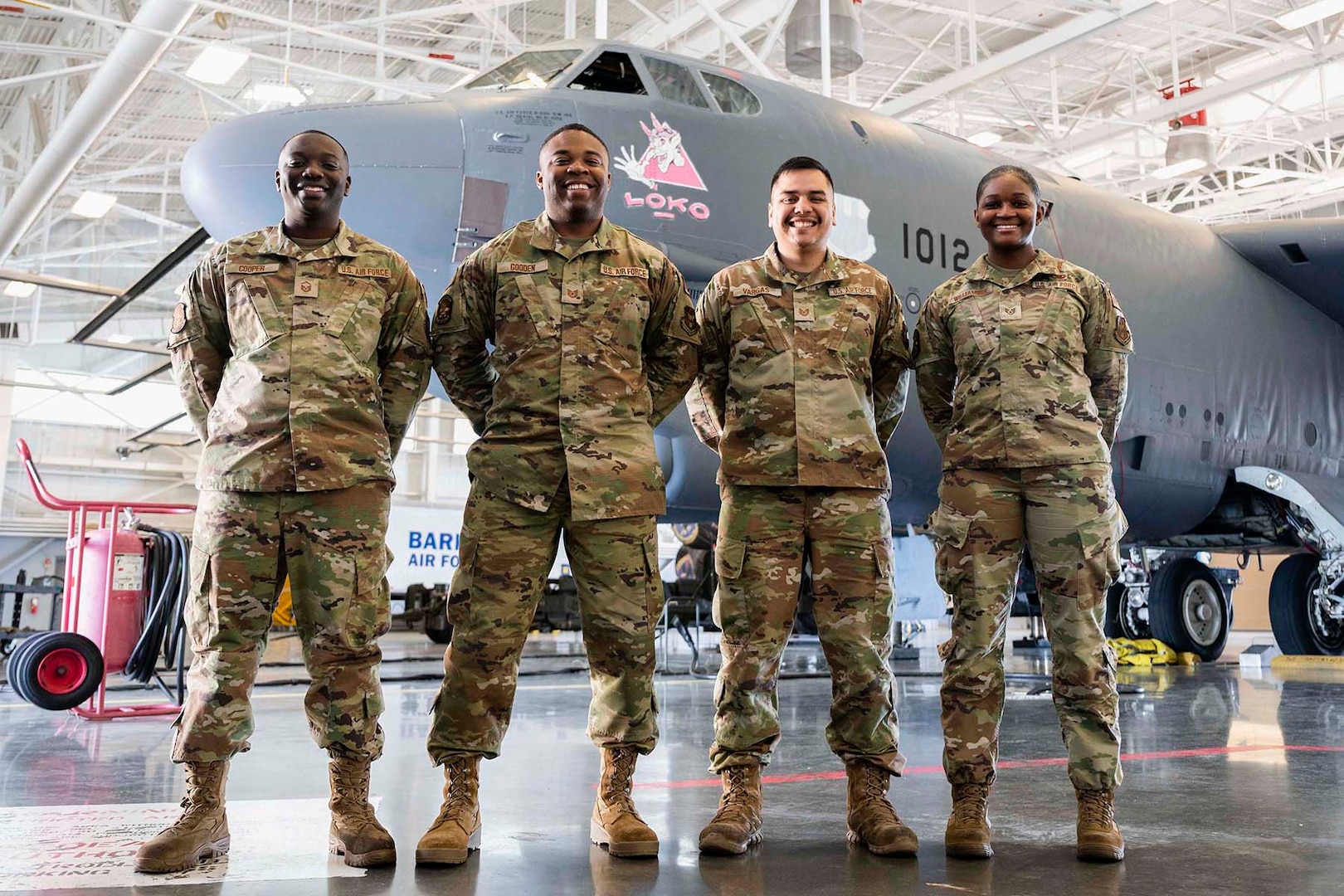 Photo of Airmen Standing in front of a B-52.