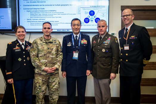  Five military officials in uniform pose for a group photo
