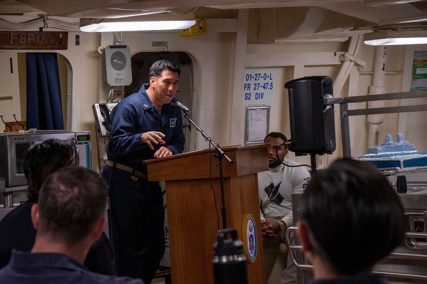 Lt. Daniel Muniz speaks about what amphibious transport dock USS Anchorage’s (LPD 23) motto, “Nil Fato Relinquemus (We leave nothing to chance)” means to him during a ceremony celebrating the 10th anniversary of Anchorage’s commissioning, May 7, 2023.