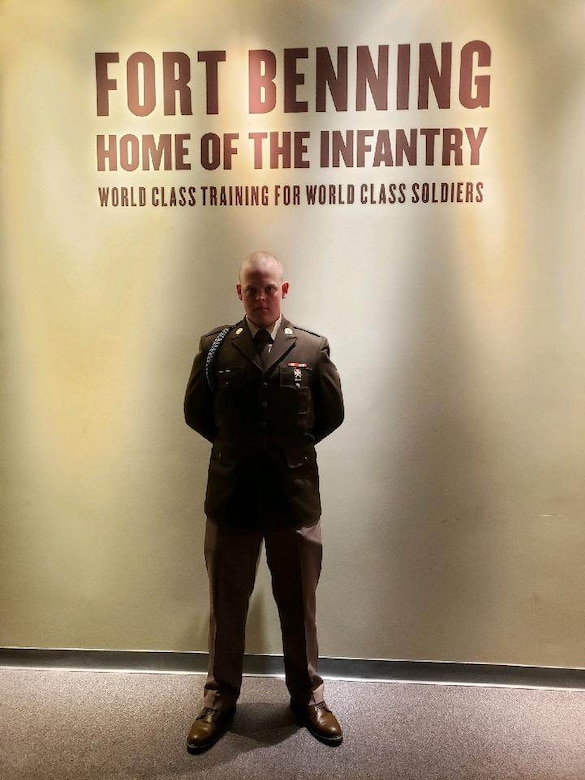 Army Soldier stands dressed in uniform.