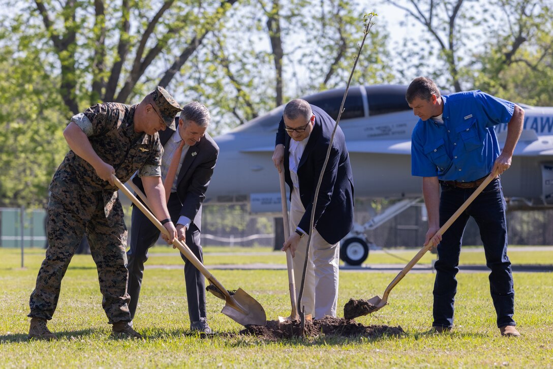 U.S. Marine Corps Col. Karl Arbogast, commanding officer, Marine Corps Air Station (MCAS) Beaufort, Jad Daley, president and chief executive officer, American Forests, Karnig Ohannessian, Deputy Assistant Secretary of the Navy of Environment and Mission Readiness, and Gary Herndon, natural and cultural resources manager, MCAS Beaufort, plant a tree during a commemorative tree planting ceremony in celebration of Earth Day at Marine Corps Air Station Beaufort, South Carolina, April 19, 2023. American Forests gifted an estimated 1,008,625 pine tree seedlings that will be planted at Townsend Bombing Range, Georgia. This reforestation effort will cover over 1600 acres. (U.S. Marine Corps photo by Lance Cpl. Kyle Baskin)