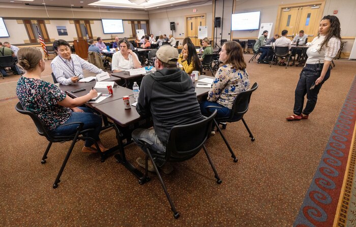 Inho Kim, deputy project superintendent, Code 312, Carrier
Program Office, leads a discussion May 3, 2023, during a Hispanic Employee Resource Organization-sponsored Speed Mentoring event at Olympic Lodge on Naval Base Kitsap-Bangor, Washington. (U.S. Navy photo Wendy Hallmark)