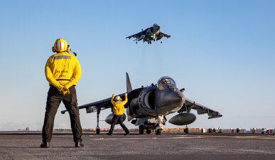 Sailors direct AV-8B Harrier II during flight operations aboard USS Wasp (LHD 1).