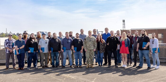 TEAM MEMBERS (from left): Joseph J. Doyle, Seth M. Zwiefelhofer, Bret M. Brown, Daniel F. Souza, Matthew D. Randle, Dennis G. Noah, Adam W. Knauss, Josh T. Fernandez, Dakota S. King, Brett W. Miller, Kyle R. Barone, Thomas L. Hengst, Kellan M. Smalley, Capt. Jip Mosman, Daniel S. Gile, Michelle L. Gilbert, Jonathan D. Fritsch, Michael C. Landin, Joseph R. Goosey, Allie M. Grega, Thomas K. Serrano, Steven K. Denton, Anthony J. Larrea, Mark M. Matos. NOT PICTURED: Heidi L. Butts, Sydney C. Harris, Douglas S. Harms, Mitchell F. Hutchison, Jacob W. Musser, Raymond C. Quitano, Morgan L. Schaleger, Mark W. Simmons, Daniel J. Smith, Alex C. Vandegrift. (U.S. Navy photo by Wendy Hallmark)