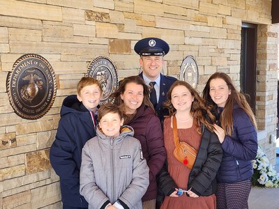 Maj. Cameron Coon and his wife, Rachel, with their four children.