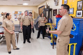 Naval Education and Training Command (NETC) domain fiscal year 2022 Sailor of the Year (SOY) candidates, their command master chiefs and SOY board members are given a tour of the Navy Recruiting Orientation Unit as part of NETC SOY Recognition Week in Pensacola, Florida, May 9, 2023. NETC's mission is to recruit, train and deliver those who serve our nation, taking them from street-to-fleet by forging civilians into highly skilled, operational and combat ready warfighters. (United States Navy photo by Mass Communication Specialist 2nd Class Zachary Melvin)