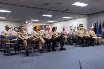 Naval Education and Training Command (NETC) domain fiscal year 2022 Sailor of the Year (SOY) candidates, their command master chiefs, SOY board members and NETC leadership listen to a brief during a visit to the Navy Recruiting Orientation Unit as part of NETC SOY Recognition Week in Pensacola, Florida, May 9, 2023. NETC's mission is to recruit, train and deliver those who serve our nation, taking them from street-to-fleet by forging civilians into highly skilled, operational and combat ready warfighters. (United States Navy photo by Mass Communication Specialist 2nd Class Zachary Melvin)