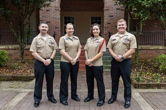 Naval Education and Training Command (NETC) domain fiscal year 2022 Sailor of the Year (SOY) candidates, from left to right, Equipment Operator 1st Class Kohl Chrislock, assigned to Naval Special Warfare Logistical Support Unit 2, Aviation Ordnancemen 1st Class Amy Morris, assigned to Surface Combat Systems Training Command, Aviation Structural Mechanic 1st Class Ashleylaura Sembrano, assigned to Recruit Training Command Great Lakes, and Navy Diver 1st Class Chase McCain, assigned to Naval Diving and Salvage Training Center, pose for a photograph during NETC SOY Recognition Week at NETC Headquarters in Pensacola, Florida, May 9, 2023. NETC's mission is to recruit, train and deliver those who serve our nation, taking them from street-to-fleet by forging civilians into highly skilled, operational and combat ready warfighters. (United States Navy photo by Mass Communication Specialist 2nd Class Zachary Melvin)
