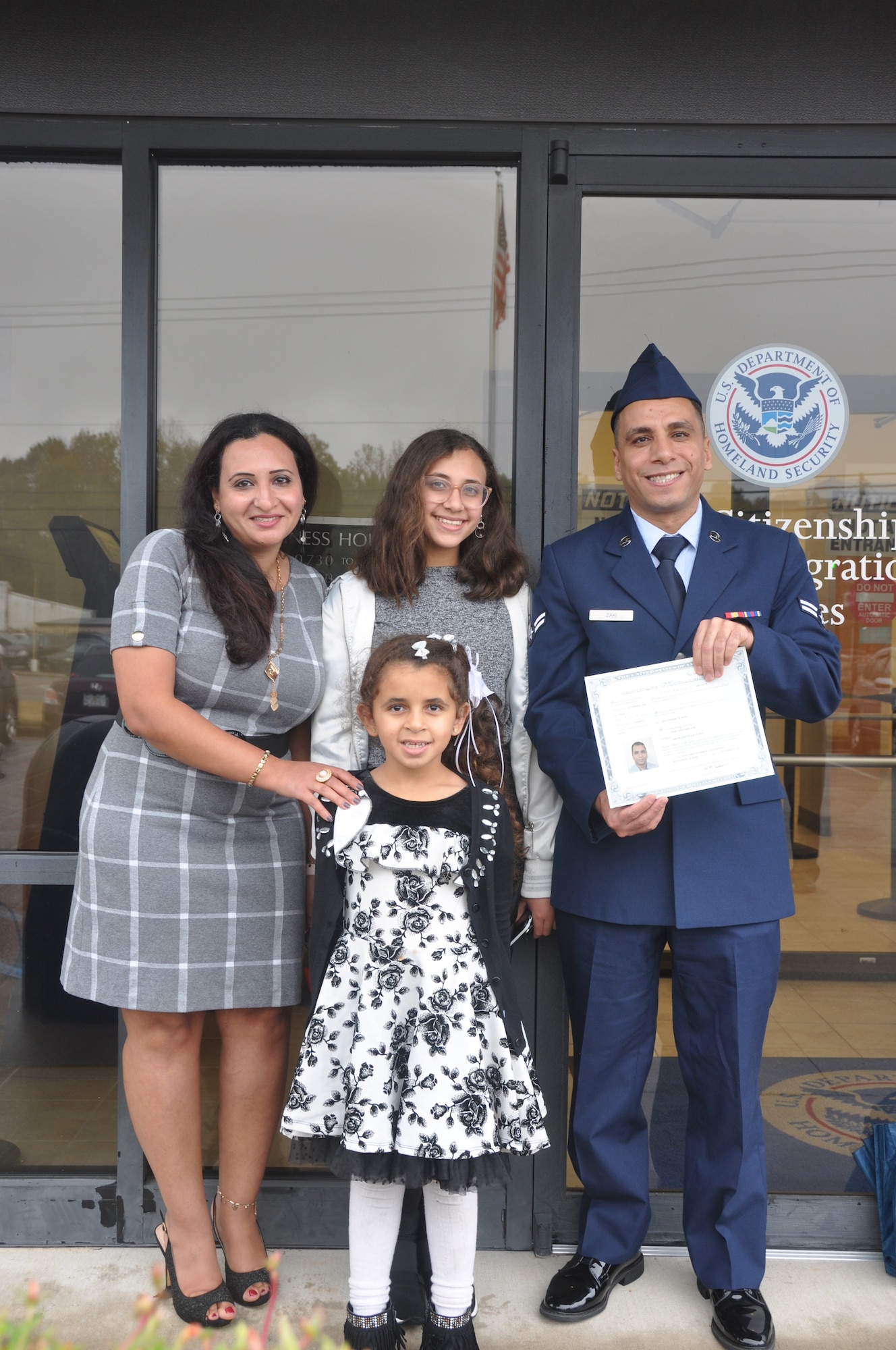 a man and his family pose for a photo