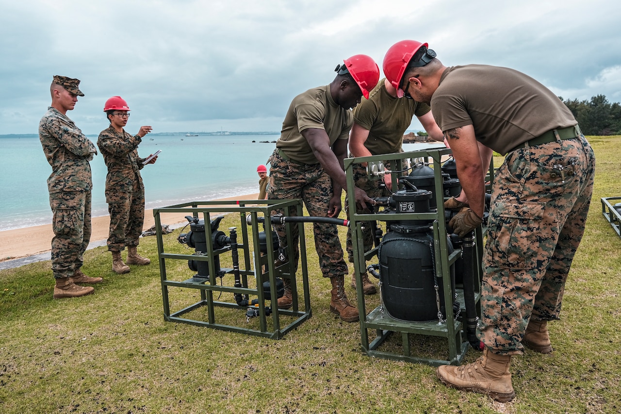 Marines set up  a water purification system.