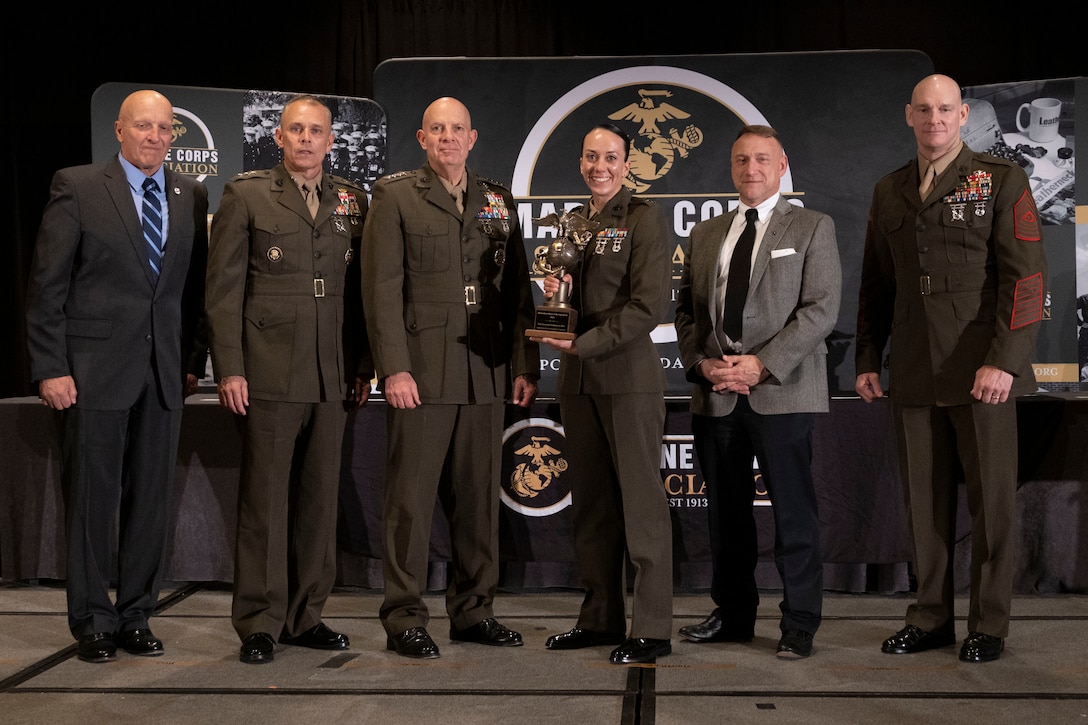 U.S. Marine Corps 1st Lt. Stephanie A. Baer, a communication strategy and operations officer with II Marine Expeditionary Force, poses for a photo with senior leadership at the annual Marine Corps Association information awards dinner in Arlington, Virginia, April 20, 2023. Baer received the Information Officer of the Year Award for outstanding performance in the information occupational field. (U.S. Marine Corps photo by Sgt. Rachaelanne Woodward)